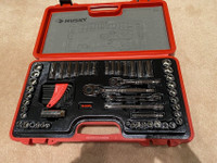 A Husky 64 piece tool set in 3/8 and 1/4 inch drive and sockets