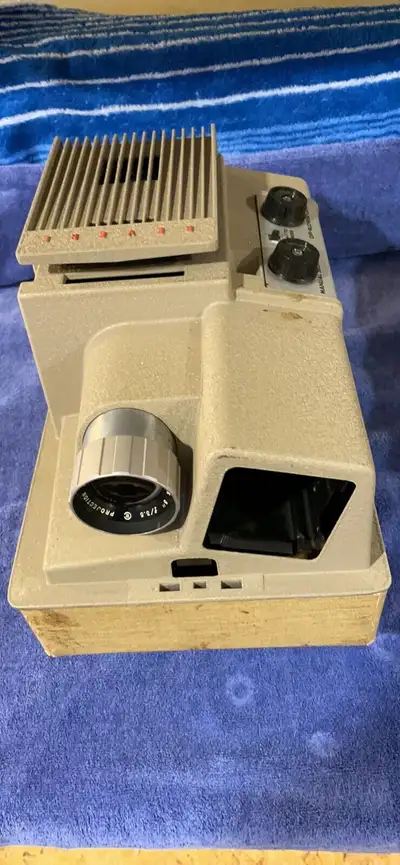 Slide projector with case, View more