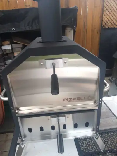 Selling wood pizza oven for decks,patios or camping trips it's in excellent condition was only used...