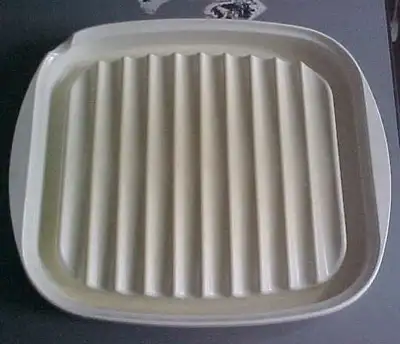 SELLING THIS MICROWAVE BACON RACK THAT MEASURES 12" X 10.5". MADE IN USA, LIKE NEW CONDITION ONLY US...