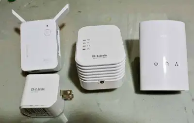 A set of D-Link range extenders and power line networking units, View more