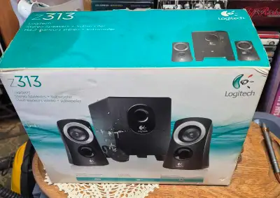 Listen up, audiophiles! I'm selling a Logitech Z313 speaker system, complete with stereo speakers an...