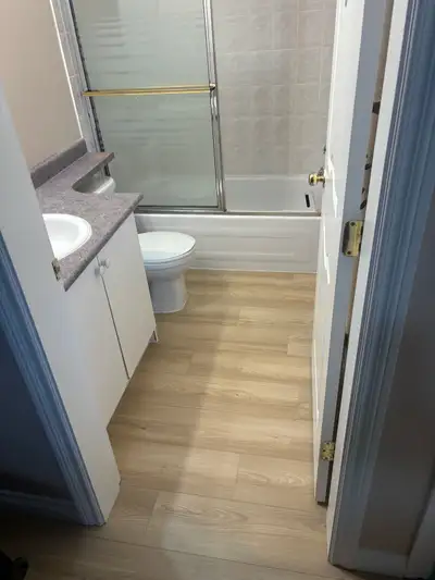 This clean and well-maintained one-bedroom basement apartment features bright, modern laminate floor...