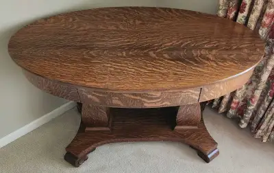 Antique Quarter Sawn Oak Oval Library Table. Measurements 471/2 inches Long, 281/2 inches wide and 2...
