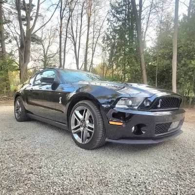 2010 Shelby GT500 SVT with less than 8,500kms. Black on Black, Slick top (no sunroof) Supercharged 5...