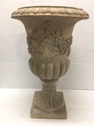 Large planter with classical themed design. Measures 32" H, 21" Diameter at top. Price is firm.