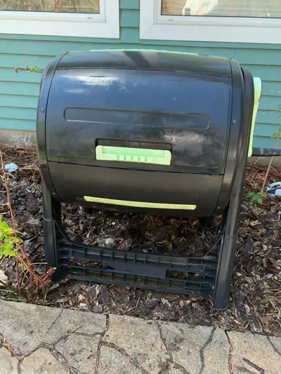 Rotating compost bin with crank and internal mixing arms. Similar ones are $250-500 new. Located in...