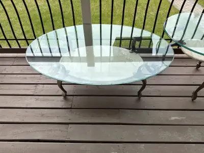 Coffee table and end tables In good Condition Cast-iron legs and marble with glass Some scratches on...
