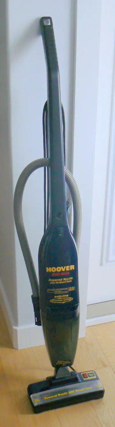 This is a Hoover upright vacuum, model number 52610-050. It's been used, but is in great working con...