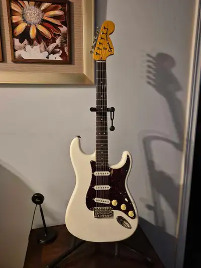 This pre-owned Squier Stratocaster is in excellent condition, ready for its next musical journey. It...