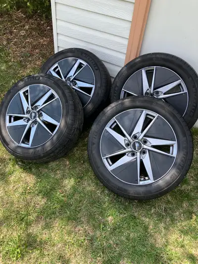 Like new! Fabulous set of lightly used premium Michelin tires on premium aluminum rims. Bolt pattern...