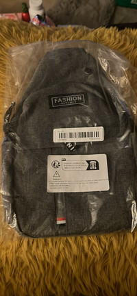 Grey cross body bag (new/sealed)