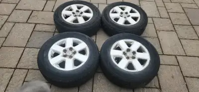 Four 16 inch all season tire Zetum 215 65 R 16 on original Sienna 2006 alloy rims, The bolt pattern...