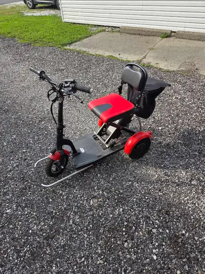 3 wheel scooter which is not required, Great to get around and visit neighbors Fold down and take to...