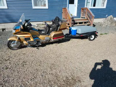 Really nice bike stored in heated basement comes with trailer v6 reverse dont use it much askin 4500...