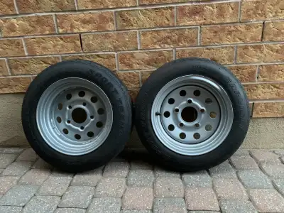 SET OF TWO TRAILER WHEELS FOR $ 60 . One rim bit bendet see on pictures but holing air good. Please...