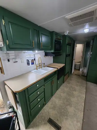 Renovated trailer! New paint and fixtures throughout, including a Kohler "Edalyn" kitchen faucet wor...