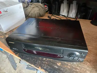 Step back in time with this used Sharp VCR, a vintage piece of technology ready to bring your old VH...