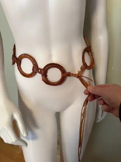 This is a very cool leather ring hippie belt with circle details, perfect for adding a bohemian touc...