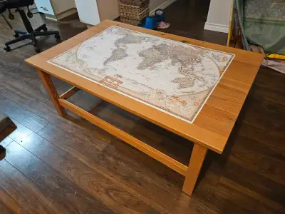 Sturdy coffee table with world map.