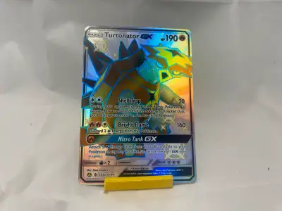 Elevate your Pokemon TCG collection with the Turtonator GX, a shiny rare card from the Hidden Fates...