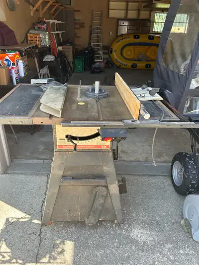 Saw in good condition with catch box for sawdust