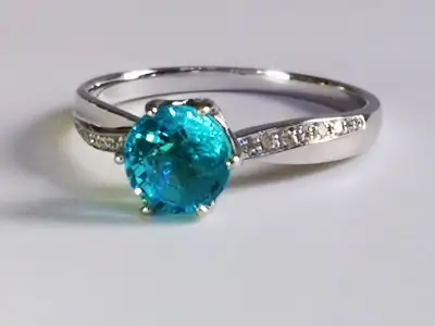 Any upcoming weddings anyone knows of? Here's an inexpensive option. Neon Blue Apatite center stone...