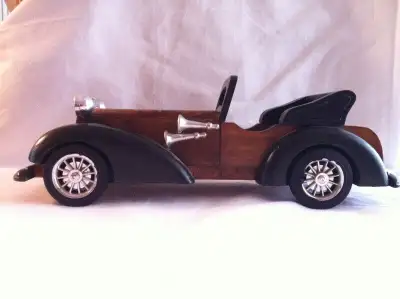 A NICE VINTAGE HAND CARVED WOODEN CAR THIS PIECE IS ALL MADE OF WOOD . THERE IS NO PLASTIC USED IN I...