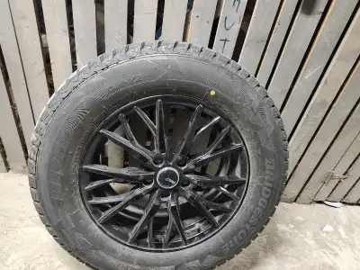 I am selling a set of Bridgestone winter tires with a tire size of 235/65R17. These tires are mounte...