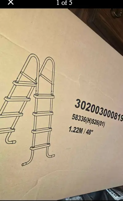 Above ground pool pump and ladder still in the box never used, View more