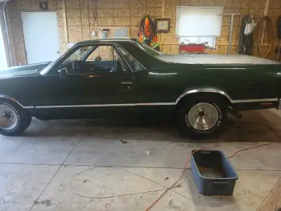 This 1984 Al Camin in striking forest green is more than just a car — it's a statement. Features: 35...