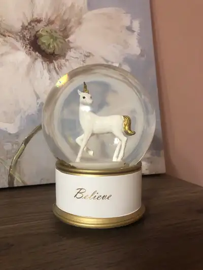 Unicorn snow globe brand new, it also plays music.