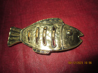Funky gold fish hair clip for sale.