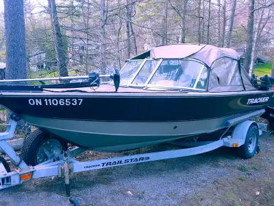 2000 Tracker Targa V17 with 75HP 2 Stroke and galvanized trailer. Welded hull, full enclosure, 50lb...