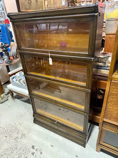 Really nice solid wood barrister bookcase. 4 tier comes apart into 6 pieces for transport. The botto...