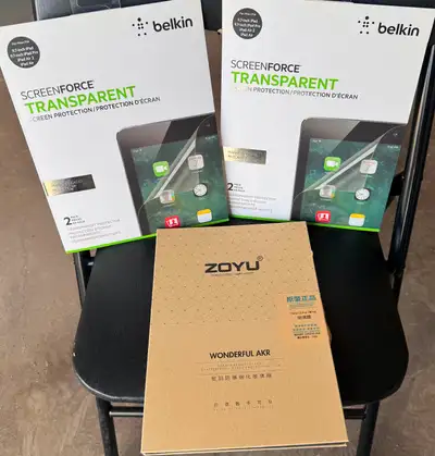 One brand new pack and 2 opened packs with brand new screen protectors inside (total 4 screen protec...