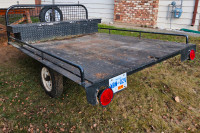 Utility trailer with tool box and spare tire