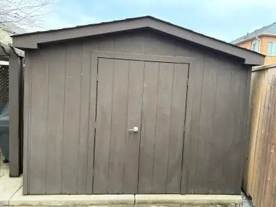 9x10 foot wooden garden shed with shingled roof. Solid structure, great for storage. Buyer responsib...