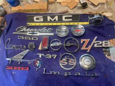 Pictures and prices from left to right GMC Rear Van Door emblem $25.00 1966 Chevrolet grill emblem $...