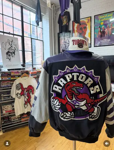 Authentic 1990’s Toronto Raptors varsity jacket featuring the original dinosaur logo from the franch...