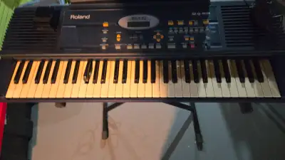 Roland E-10 keyboard and stand, View more