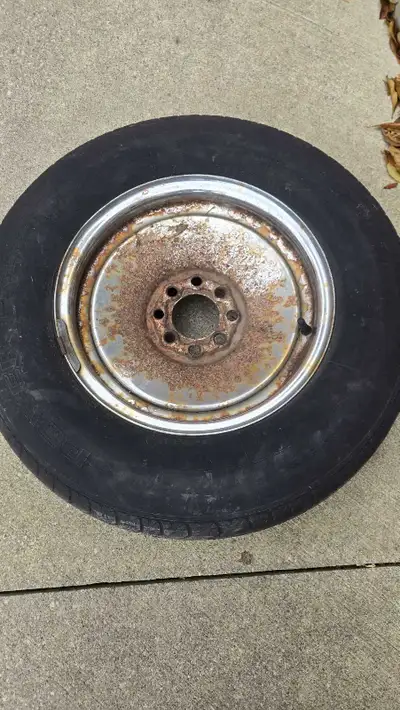 This is a 205/75/R14 trailer tire mounted on a universal rim.