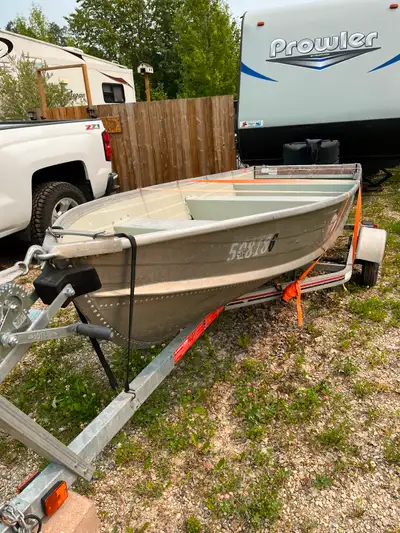 14 foot aluminum fishing boat with trailer. Both in excellent condition, also included an electric t...