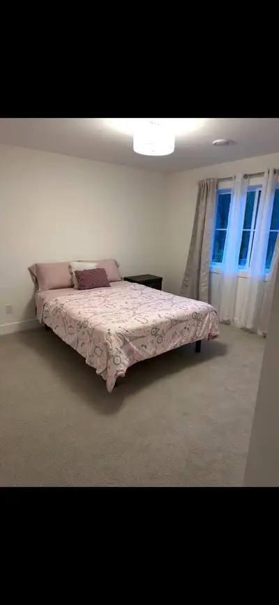 Beautiful large furnished room for female roommate in a new house. Quiet safe neighborhood with bus...