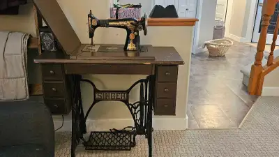 This vintage Singer sewing machine is a beautiful piece of history ready for a new home! Given its a...