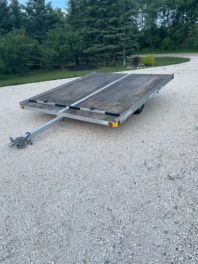 Forest River trail rider aluminum tilt trailer. Perfect for two snowmobiles or a side by side. Tires...