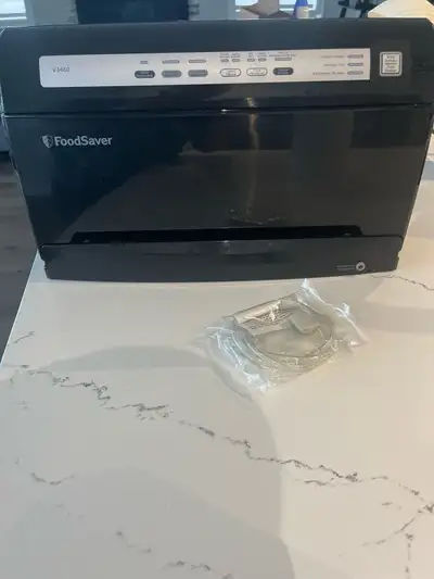 pre-owned FoodSaver V3460 vacuum sealing system, designed for effortless food preservation. This uni...