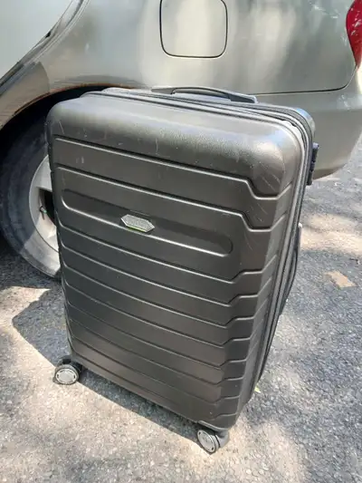 This is a hard shell suitcase, perfect for travel! It is used but still in good condition. The suitc...