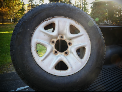 Bridgestone Blizzak 255/70R18 winter tires with approximately 45% tread. Mounted on factory Toyota T...