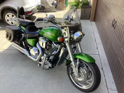 Candy Apple Green, Vance & Hines pipes, Mustang Custom seat, Boss Leather Saddle bags, tank skirt, n...